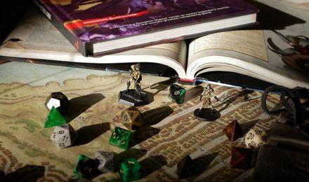 Tabletop game miniatures and dice on a board